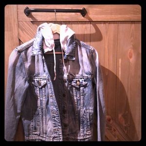 Jean jacket with grey hood.